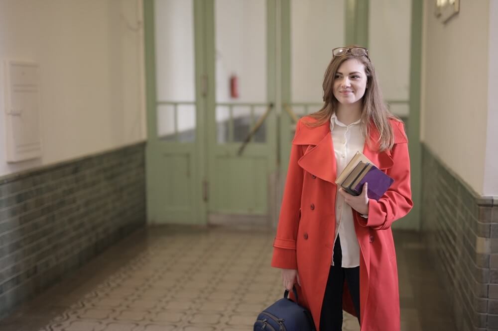 Girl-holding-books-confident-self
