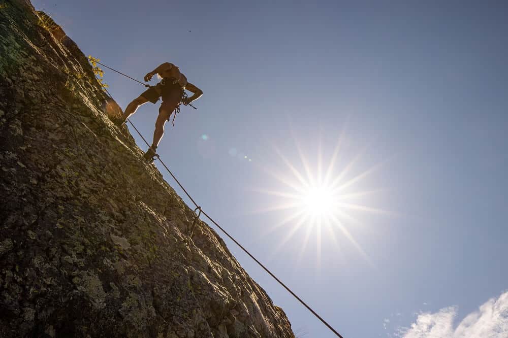self-efficacy-man-climbing-mountain