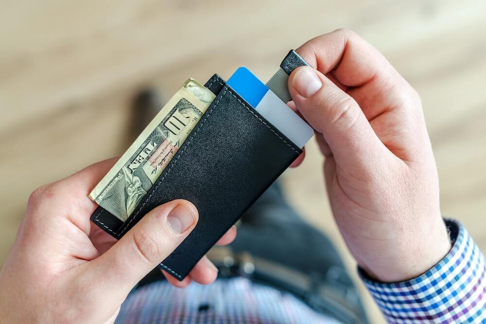 abundance-mindset-person-holding-wallet