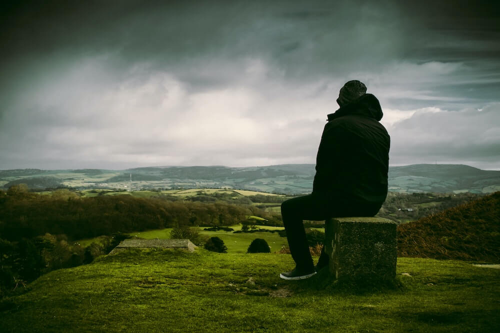 Man-sitting-outdoor-silent-retreat