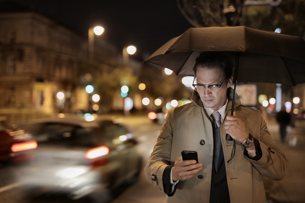 man-looking-smartphone-social-media-addiction