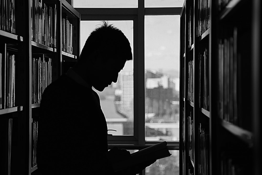 Man-Silhouette-library-reading-self-worth