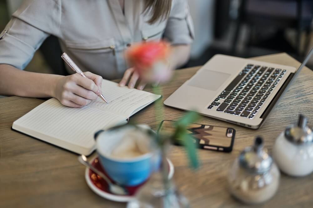 Person-notebook-journaling-self-worth