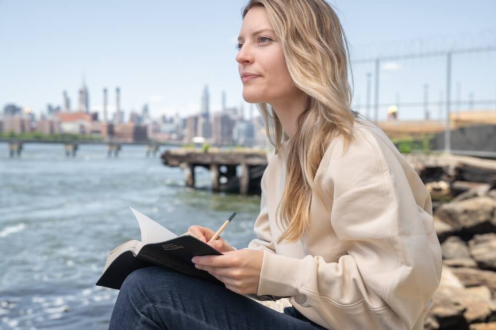 Woman-writing-notes-deal-breakers