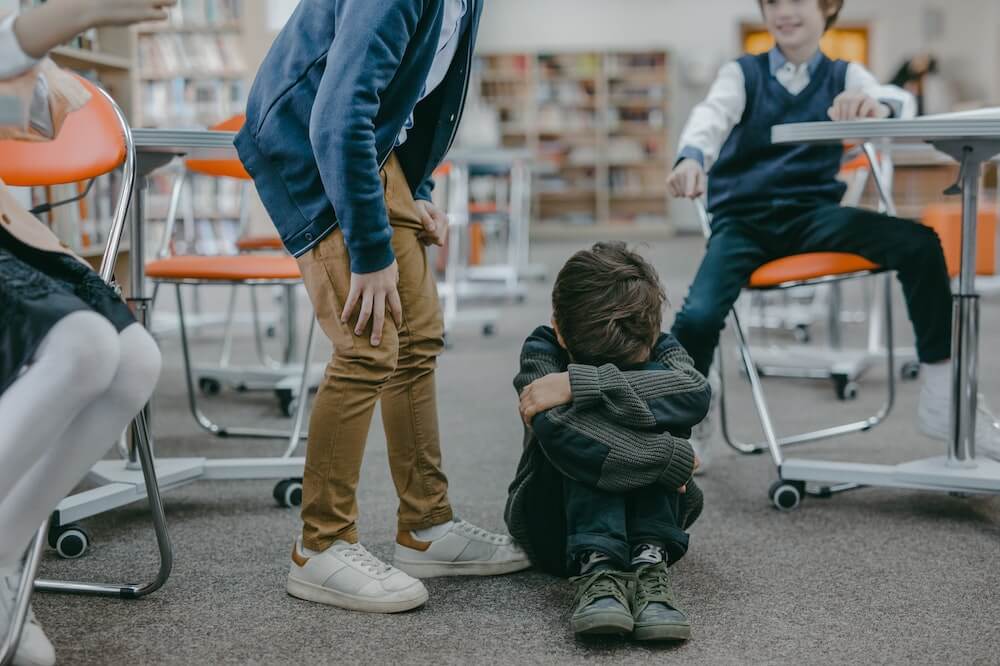 boy-bullied-classroom-childhood-trauma