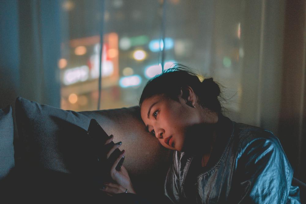 9 Ways Slow Living Can Lead To A Magical Sustainable Life 8 Slow-living-woman-checking-smartphone