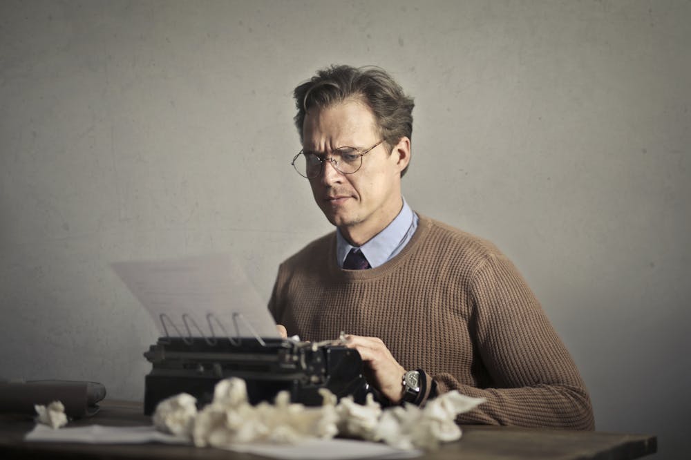 Man-frowning-typewriter-Next-Level