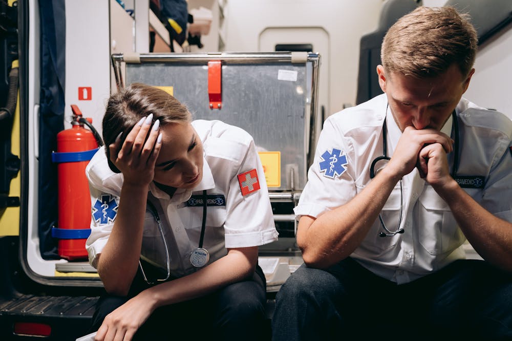 Paramedics-Sitting-on-Ambulance-Regret