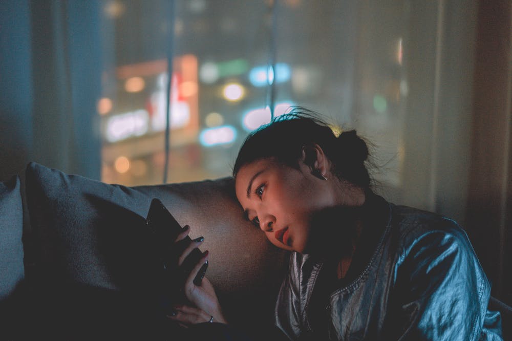 Ghosting-Woman-Staring-At-Phone
