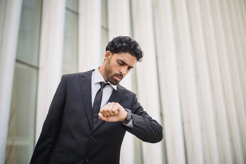 Man-Suit-Looking-at-Watch