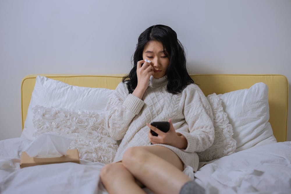 Sad-Woman-Looking-At-Cellphone