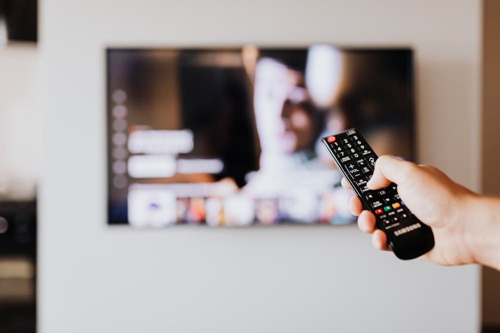 Binge-Watching-Person-pressing-remote