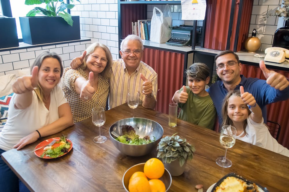 Family-at-table-Showing-thumbs-up