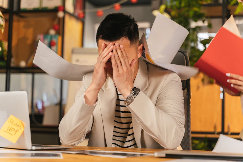 Man-Feeling-Overwhelmed-at-work