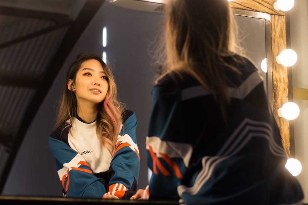 Woman-Looking-At-Mirror-Smiling