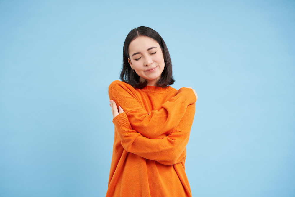 Girl-Hugs-Herself-Self-Compassion