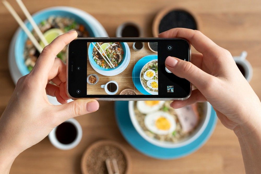 Influencer-Culture-Person-taking-photo-Breakfast