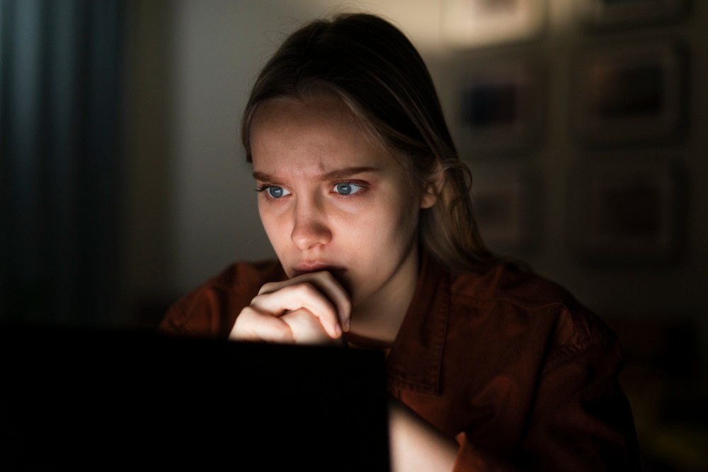 AI-Anxiety-woman-working-on-laptop