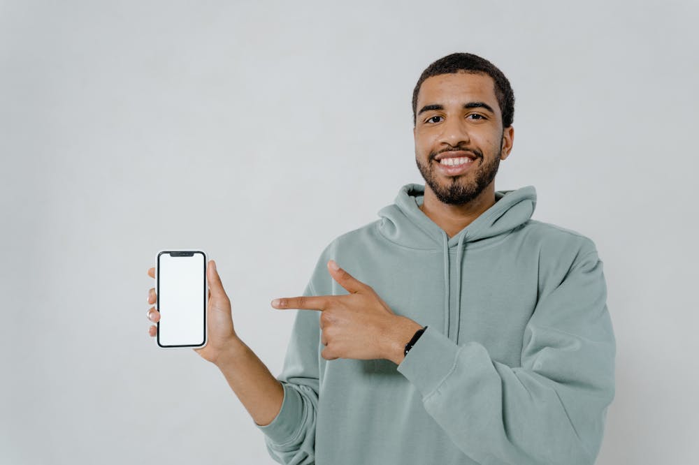 Man-In-Hoodie-Holding-Smart-Phone