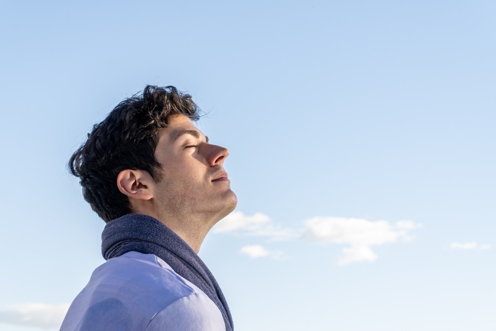 Man-Look-up-At-Sky-Eyes-Closed