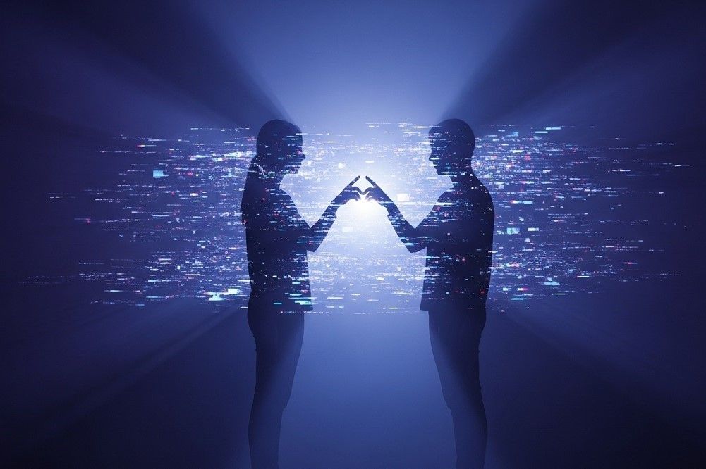 Two-Silhouettes-Almost-Touching-Hands