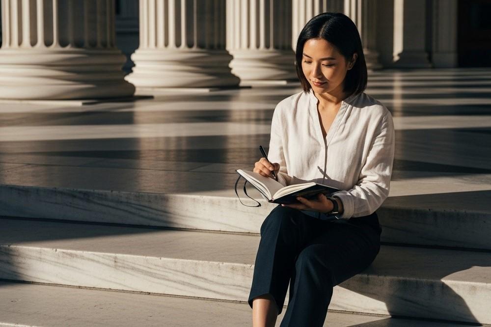 Woman-Sitting-On-Marble-Steps