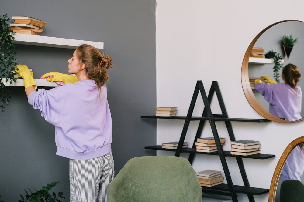 Woman-Wearing-Gloves-Cleaning-Shelves