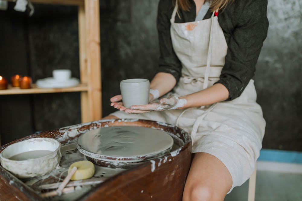 Woman-holding-Wet-Clay-Pot