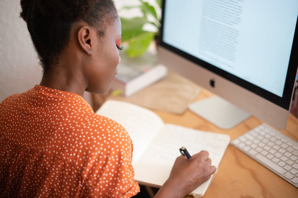 Woman-writing-in-her-notebook