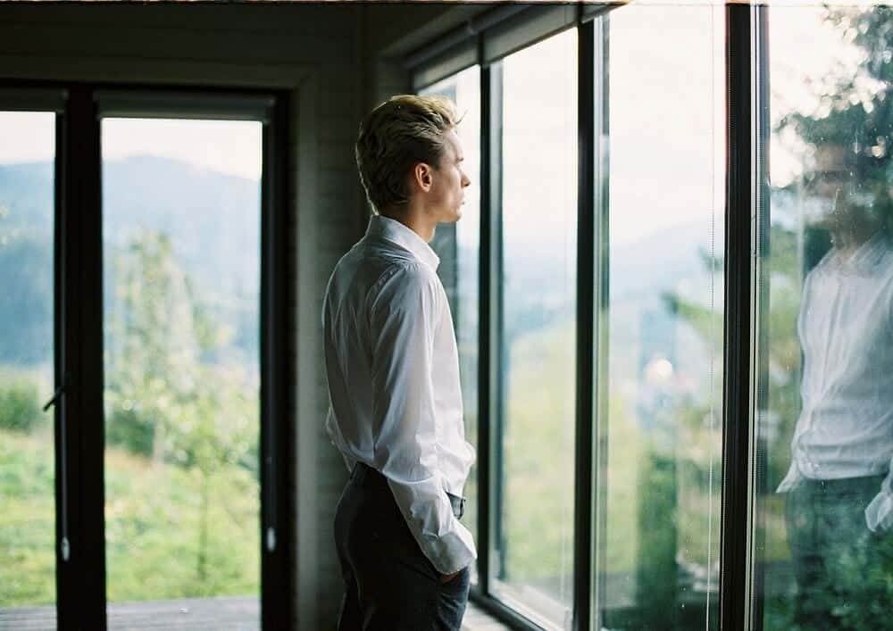 man-looking-out-of-window