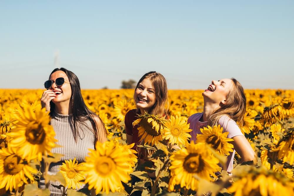 three-happy-girls-sunflower-field