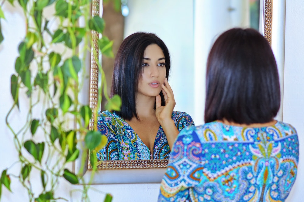 Woman-Looking-at-Mirror-Self-Reflection