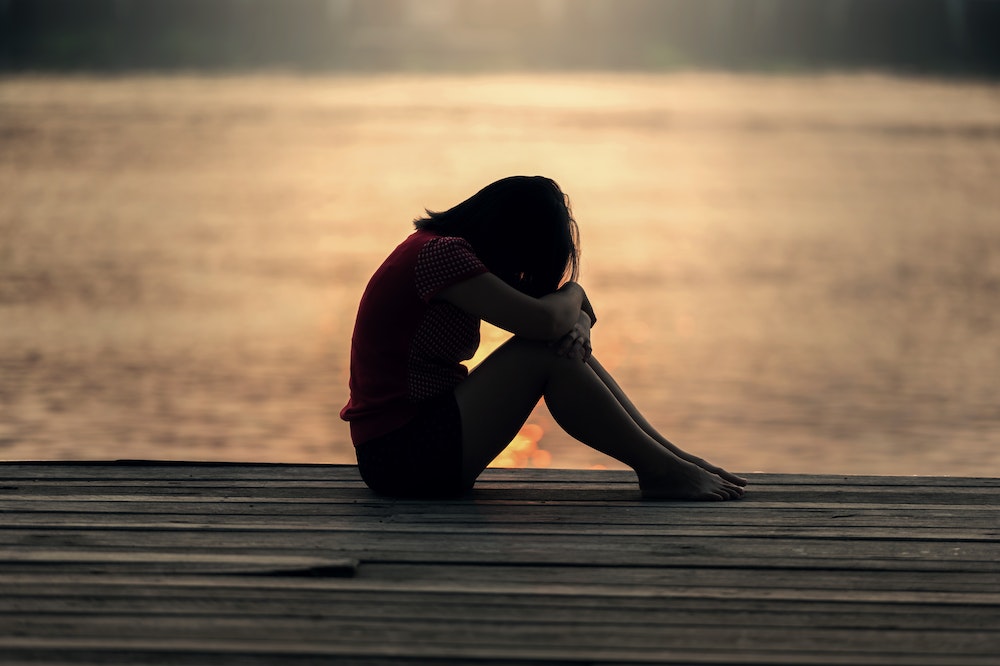 Woman-Sitting-Childhood-Trauma