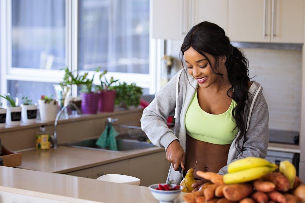 How The Benefits Of Holistic Health Unlock Your Best Life 1 Holistic-health-woman-slicing-gourd