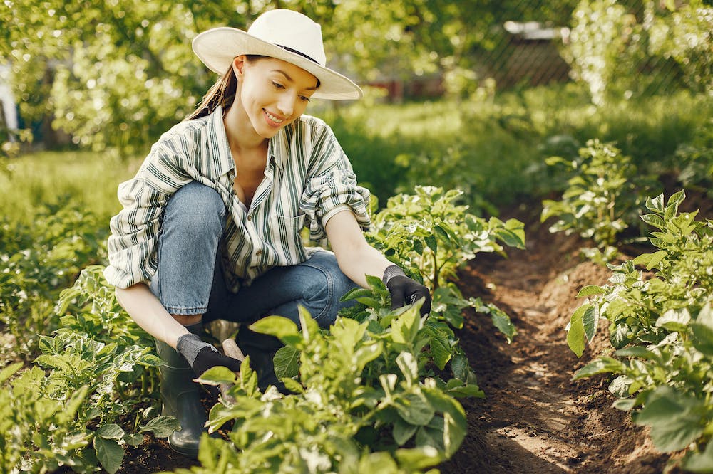 9 Ways Slow Living Can Lead To A Magical Sustainable Life 2 Slow living Woman gardening