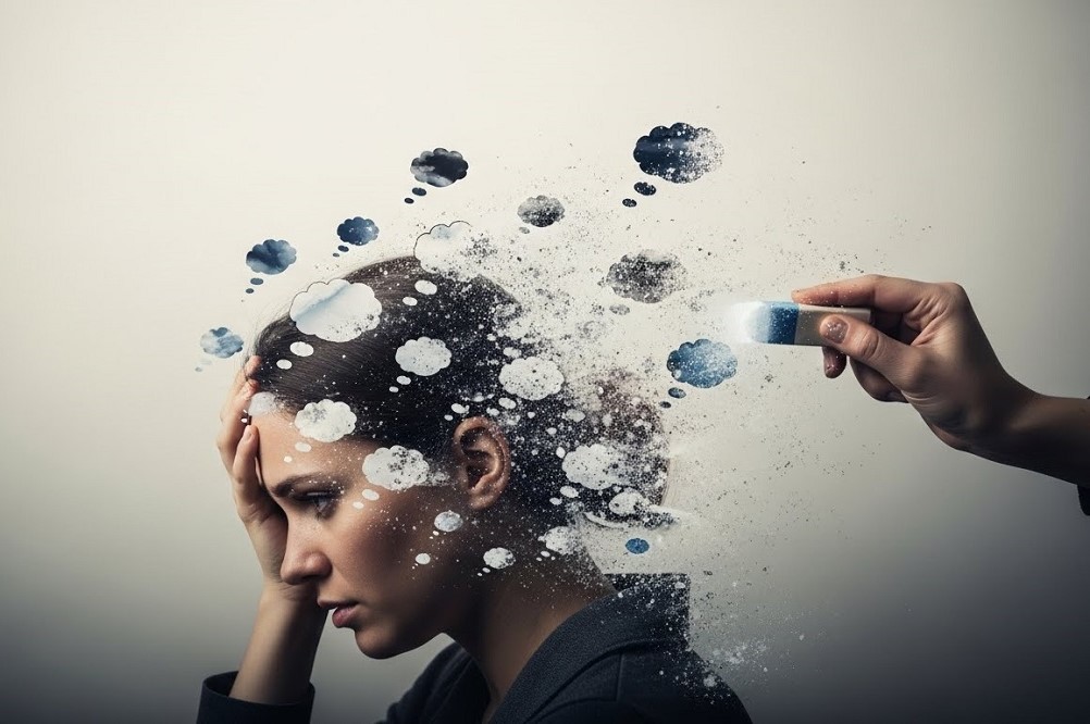 Hand-With-Eraser-Wiping-Away-Woman's-Thoughts