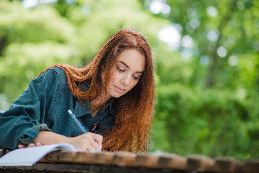 Girl-writing-in-notebook