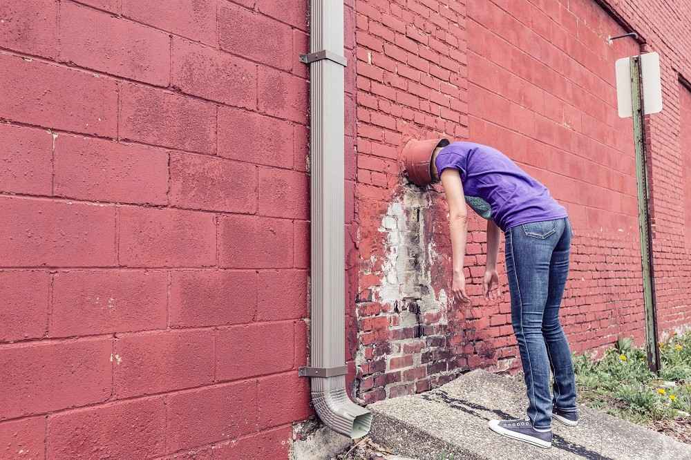 Feeling-Stuck-Person-Head-Inside-Wall